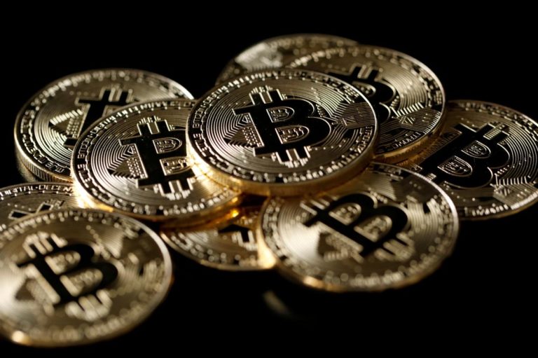 UPDATE 1-Bitcoin slips below $14,000, down 30 pct from record peak