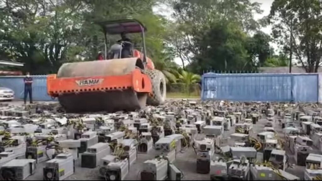 Viral Video Shows Malaysian Police Destroying 1,069 Bitcoin Mining Rigs With a Steamroller