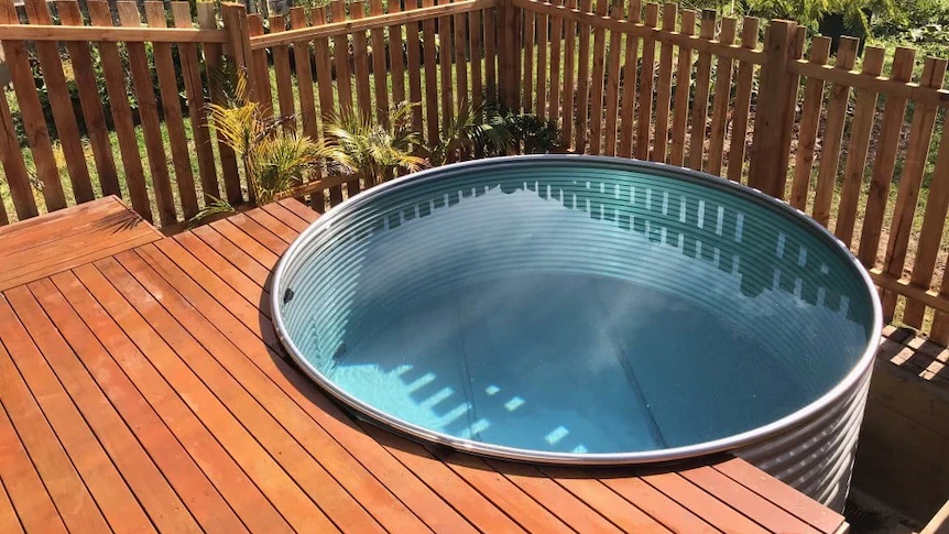 Why spend $50,000 on a pool when you can use a livestock water tank instead?