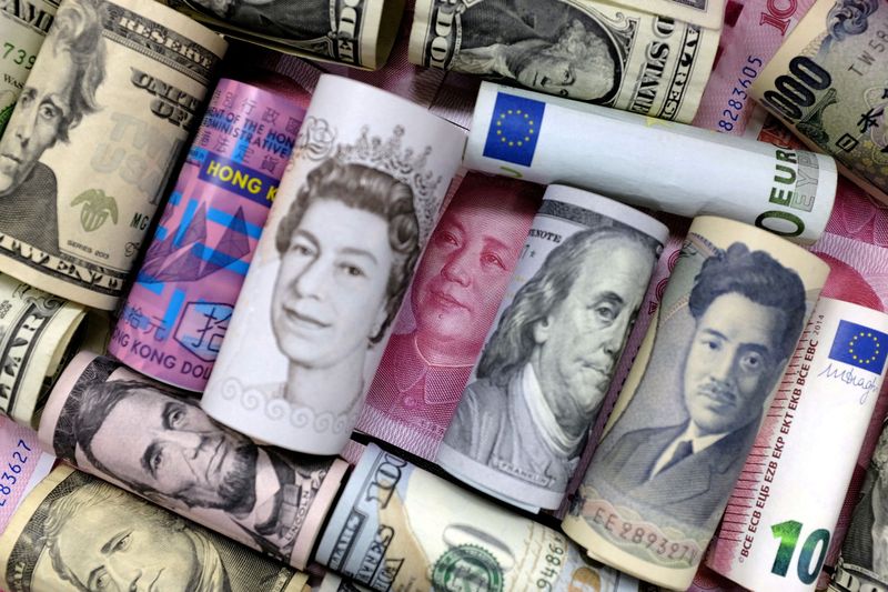 Euro rises as talks over Ukraine begin, modest yen rebound